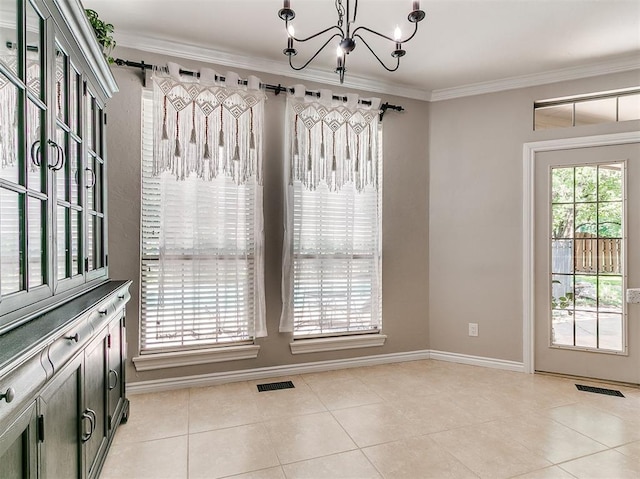 3133 Beacon Hill St, Edmond, OK 73034 - unfurnished dining area with a chandelier, ornamental molding, and light tile patterned floors
