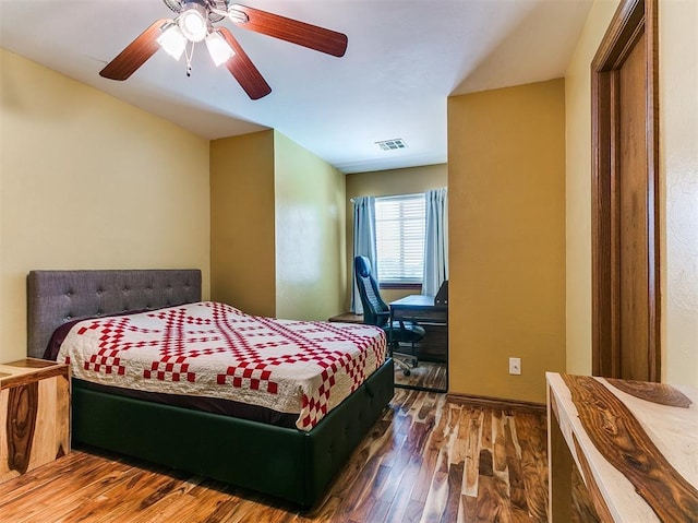 3133 Beacon Hill St, Edmond, OK 73034 - bedroom with wood finished floors and ceiling fan