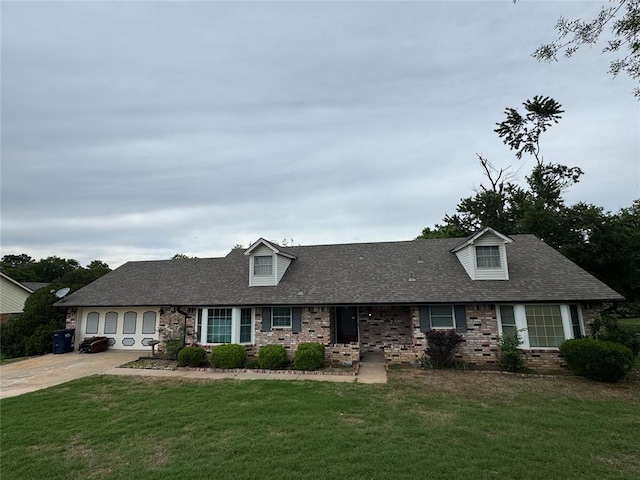 804 William Blvd, Seminole, OK 74868 - view of front of home featuring roof with shingles, a front lawn, and brick siding