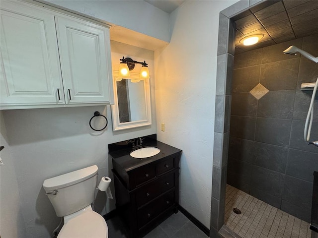 804 William Blvd, Seminole, OK 74868 - bathroom featuring vanity, toilet, tile patterned floors, and a tile shower