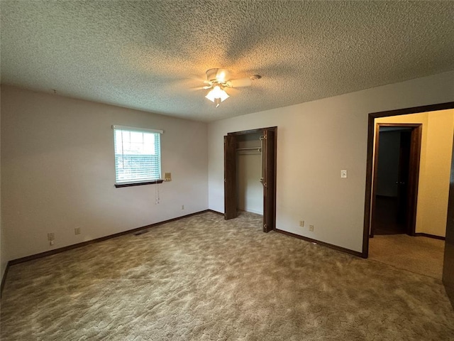 804 William Blvd, Seminole, OK 74868 - unfurnished bedroom featuring carpet flooring, a ceiling fan, a closet, a textured ceiling, and baseboards