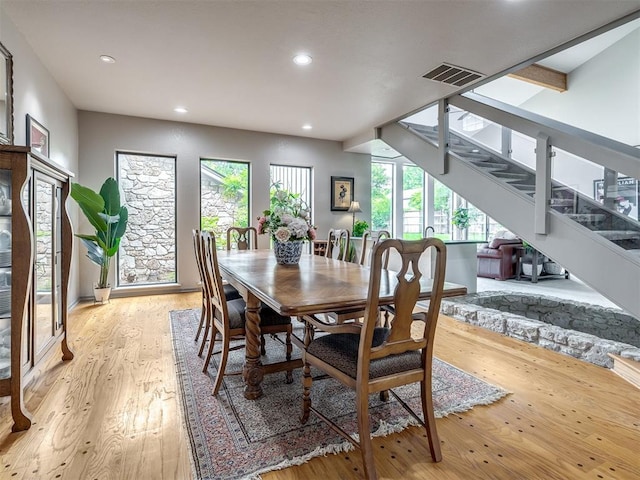 1011 Saint Andrews Dr, Edmond, OK 73025 - dining space with light wood-style floors, recessed lighting, and stairs