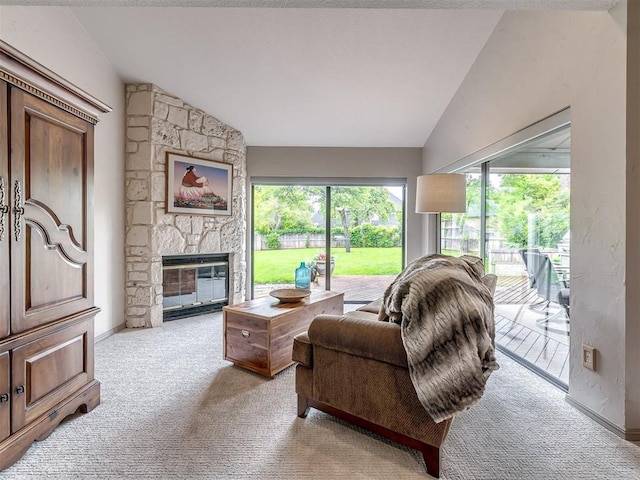 1011 Saint Andrews Dr, Edmond, OK 73025 - living room featuring lofted ceiling, light colored carpet, and a fireplace