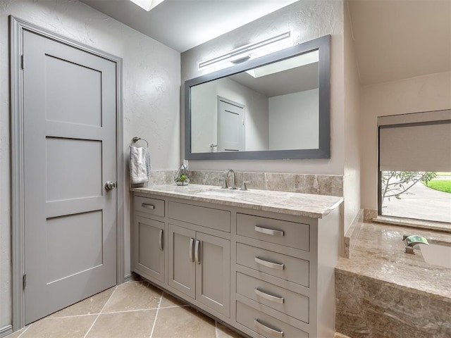 1011 Saint Andrews Dr, Edmond, OK 73025 - bathroom featuring vanity and tile patterned flooring