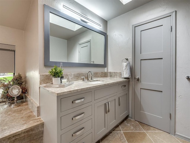 1011 Saint Andrews Dr, Edmond, OK 73025 - bathroom featuring vanity and stone finish floors