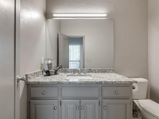 1011 Saint Andrews Dr, Edmond, OK 73025 - bathroom with vanity and toilet
