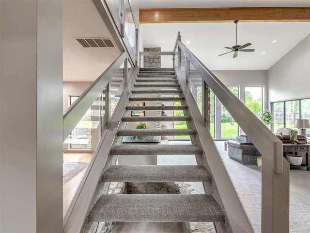 1011 Saint Andrews Dr, Edmond, OK 73025 - stairs featuring a ceiling fan and carpet floors