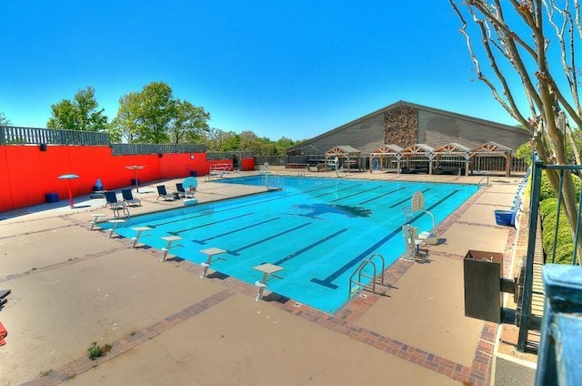 1011 Saint Andrews Dr, Edmond, OK 73025 - community pool with a patio area