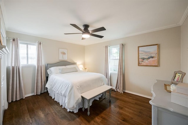 3205 NW 54th Cir, Oklahoma City, OK 73112 - bedroom with dark wood-style floors, ornamental molding, and a ceiling fan