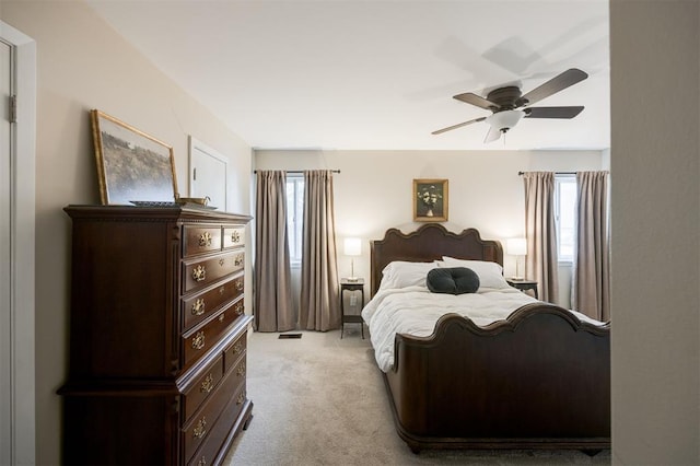 3205 NW 54th Cir, Oklahoma City, OK 73112 - bedroom featuring light colored carpet and ceiling fan