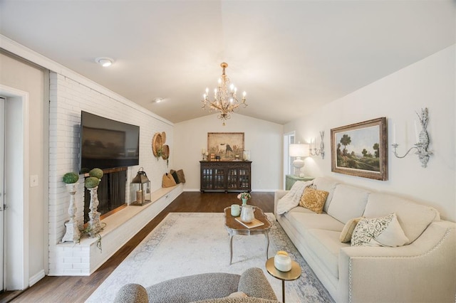 3205 NW 54th Cir, Oklahoma City, OK 73112 - living area with dark wood-style flooring, a chandelier, and vaulted ceiling