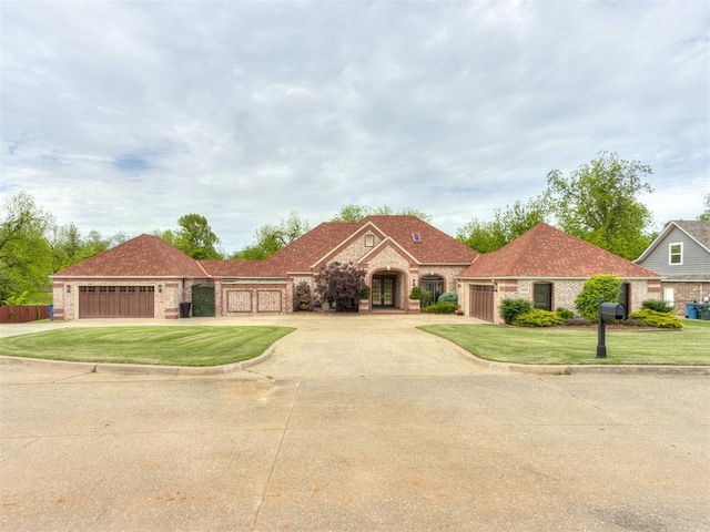 9408 S Caldwell Dr, Midwest City, OK 73130 - mediterranean / spanish-style house with brick siding and a front lawn