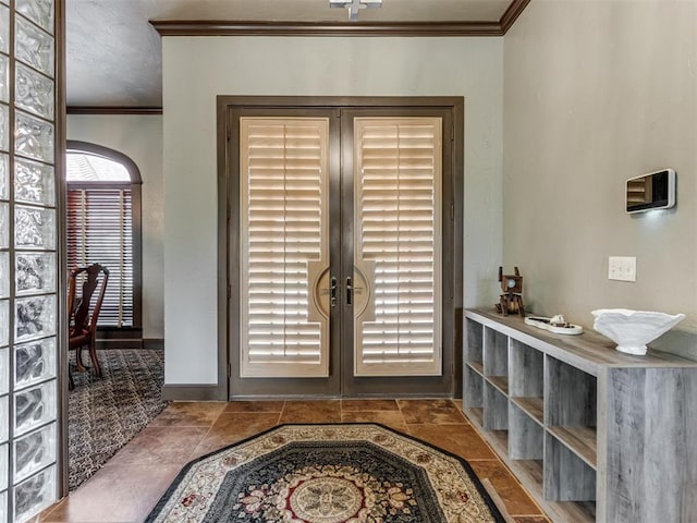 9408 S Caldwell Dr, Midwest City, OK 73130 - entryway featuring crown molding, french doors, stone finish floors, and baseboards