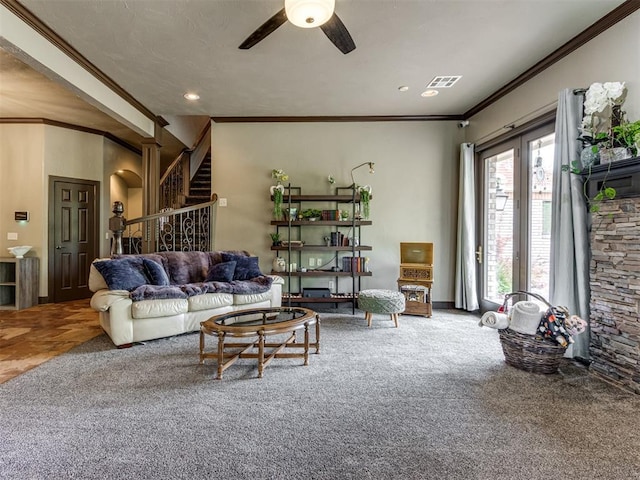 9408 S Caldwell Dr, Midwest City, OK 73130 - carpeted living room featuring ornamental molding, ceiling fan, stairs, and recessed lighting