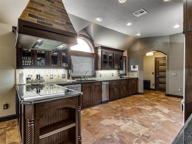 9408 S Caldwell Dr, Midwest City, OK 73130 - kitchen featuring arched walkways, range hood, dark brown cabinetry, baseboards, and backsplash