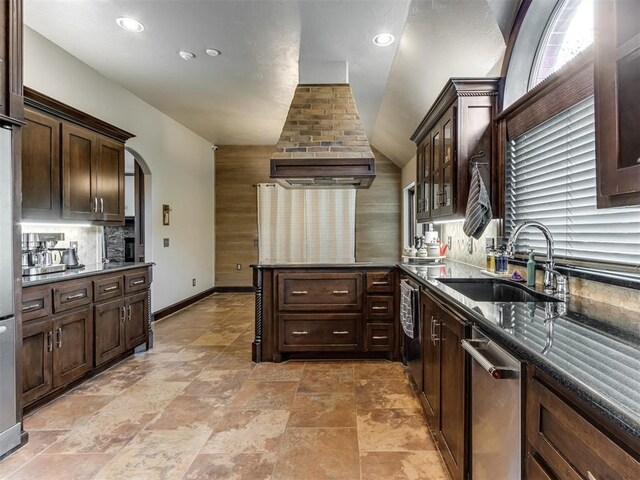 9408 S Caldwell Dr, Midwest City, OK 73130 - kitchen with a sink, a peninsula, tasteful backsplash, dark brown cabinets, and vaulted ceiling
