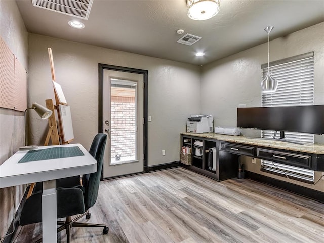 9408 S Caldwell Dr, Midwest City, OK 73130 - office with light wood-style flooring, recessed lighting, and a textured wall