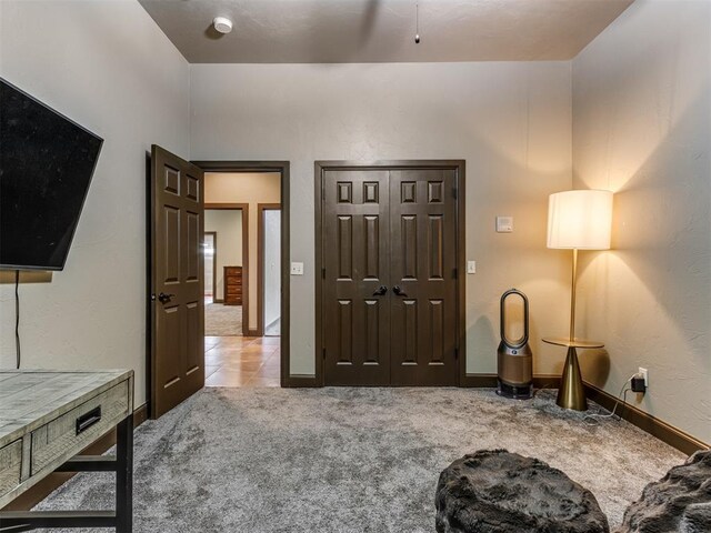 9408 S Caldwell Dr, Midwest City, OK 73130 - carpeted bedroom featuring baseboards and tile patterned floors