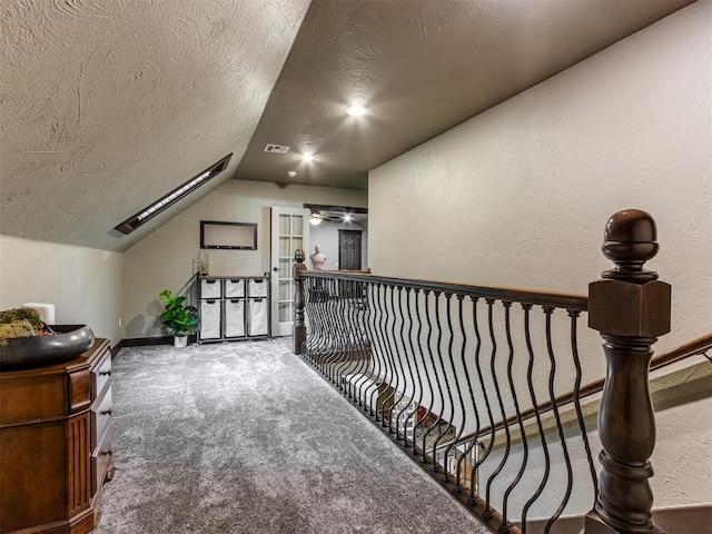 9408 S Caldwell Dr, Midwest City, OK 73130 - bonus room featuring vaulted ceiling, a textured ceiling, carpet flooring, baseboards, and a textured wall