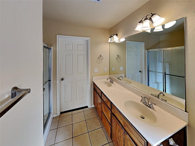 full bathroom featuring a stall shower and a sink
