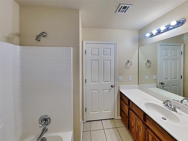 full bath with tile patterned flooring, vanity, visible vents, and shower / bathing tub combination