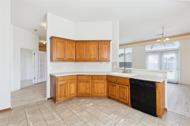 kitchen featuring a sink, brown cabinetry, light countertops, and dishwasher