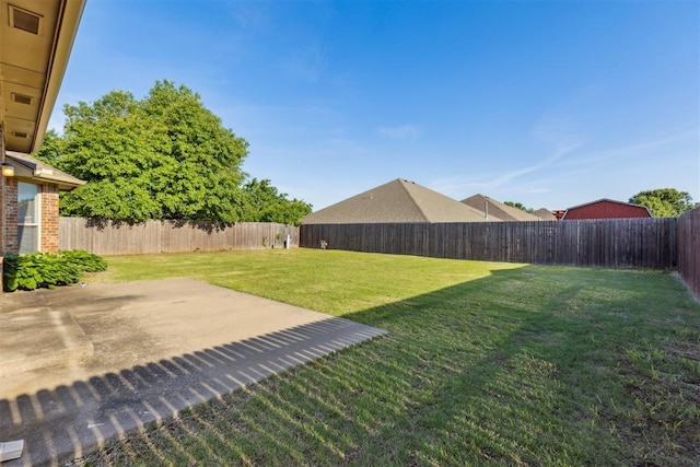 view of yard featuring a fenced backyard and a patio area