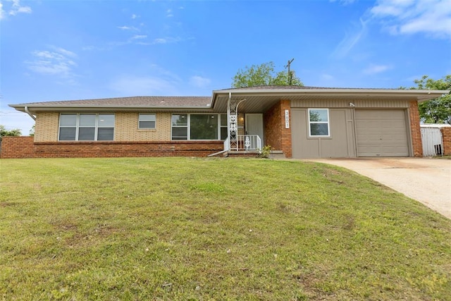 3601 N Terry Ave, Oklahoma City, OK 73111 - ranch-style home with a garage, a front lawn, brick siding, and driveway