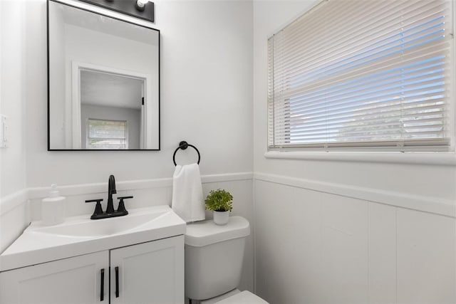 3601 N Terry Ave, Oklahoma City, OK 73111 - bathroom with toilet, wainscoting, and vanity