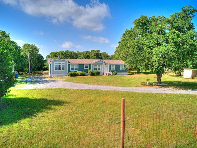 view of front of house with driveway and a front yard