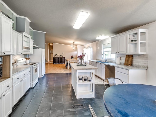 kitchen featuring white cabinetry, white appliances, open shelves, and decorative backsplash