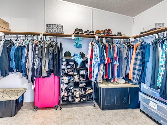 spacious closet with tile patterned flooring
