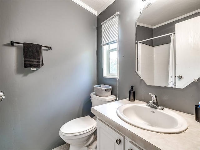 bathroom with toilet, curtained shower, vanity, and ornamental molding