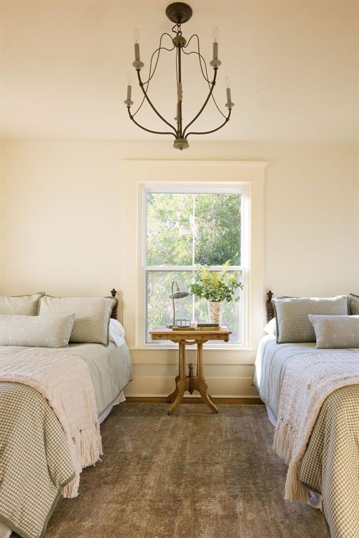 1801 N Broadway Ave, Shawnee, OK 74804 - bedroom with a notable chandelier and baseboards