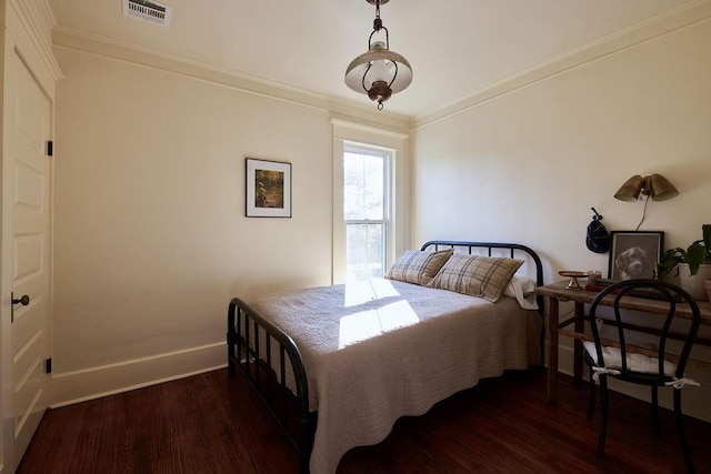 1801 N Broadway Ave, Shawnee, OK 74804 - bedroom featuring baseboards, crown molding, visible vents, and wood finished floors