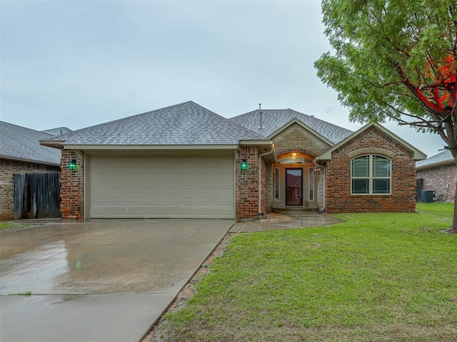 7705 Twin Oaks Dr, Yukon, OK 73099 - single story home featuring a garage, cooling unit, roof with shingles, concrete driveway, and brick siding