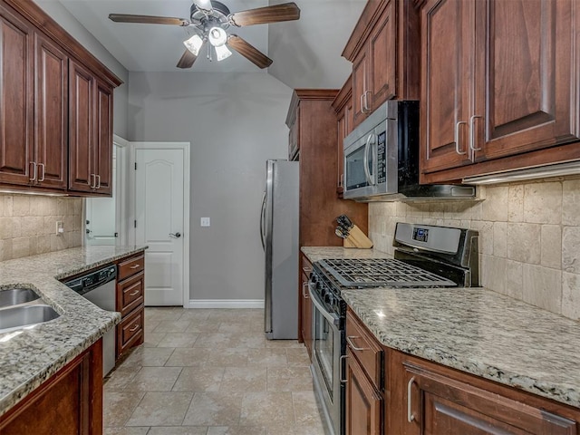 7705 Twin Oaks Dr, Yukon, OK 73099 - kitchen featuring stainless steel appliances, tasteful backsplash, baseboards, light stone counters, and ceiling fan