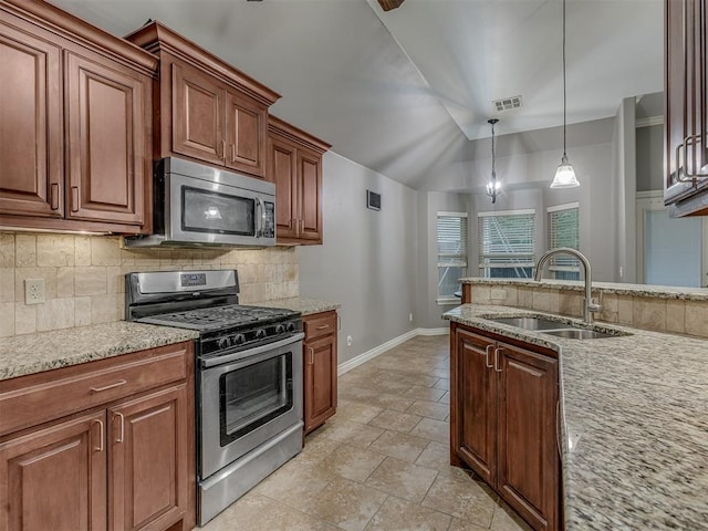 7705 Twin Oaks Dr, Yukon, OK 73099 - kitchen with appliances with stainless steel finishes, a sink, backsplash, baseboards, and light stone countertops