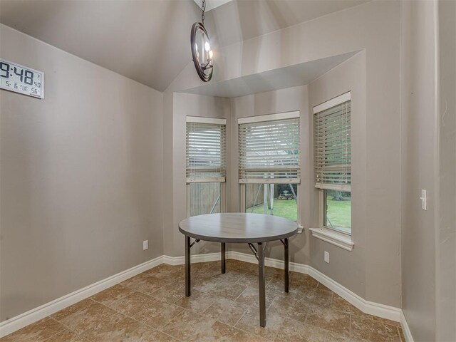 7705 Twin Oaks Dr, Yukon, OK 73099 - dining space with vaulted ceiling and baseboards