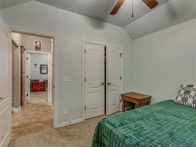 7705 Twin Oaks Dr, Yukon, OK 73099 - bedroom featuring lofted ceiling, light carpet, baseboards, a closet, and ceiling fan