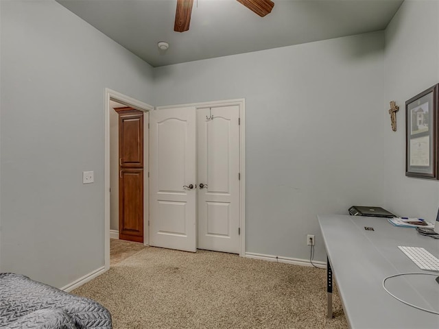 7705 Twin Oaks Dr, Yukon, OK 73099 - bedroom with baseboards, light colored carpet, and a desk