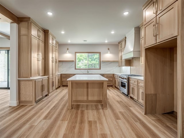kitchen with open shelves, high end range, custom range hood, light wood-type flooring, and recessed lighting