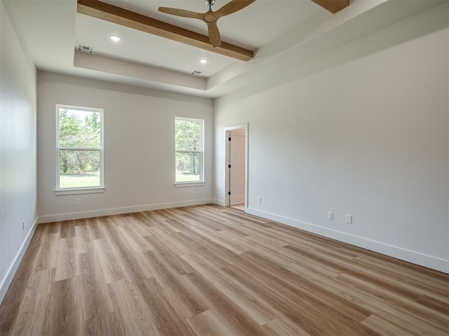 unfurnished room with light wood-style flooring, ceiling fan, beamed ceiling, baseboards, and recessed lighting
