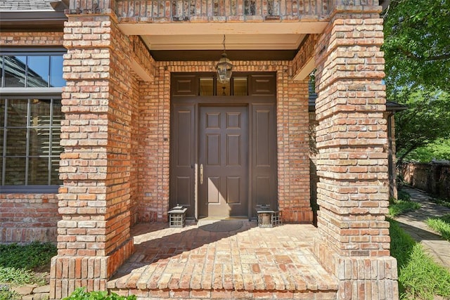 368 Millbrook Dr, Norman, OK 73072 - doorway to property with brick siding and a balcony