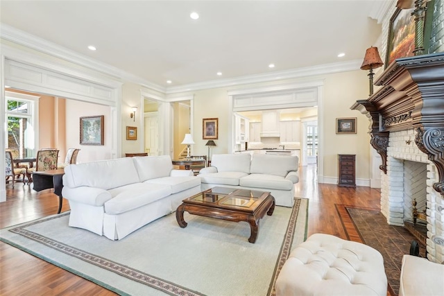 368 Millbrook Dr, Norman, OK 73072 - living room featuring healthy amount of natural light, wood finished floors, ornamental molding, a fireplace, and recessed lighting
