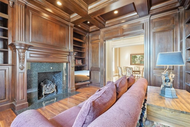 368 Millbrook Dr, Norman, OK 73072 - living area with built in shelves, ornamental molding, a fireplace, coffered ceiling, and beamed ceiling