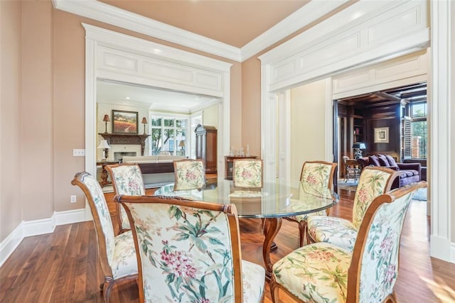 368 Millbrook Dr, Norman, OK 73072 - dining area featuring ornamental molding, a large fireplace, wood finished floors, and baseboards