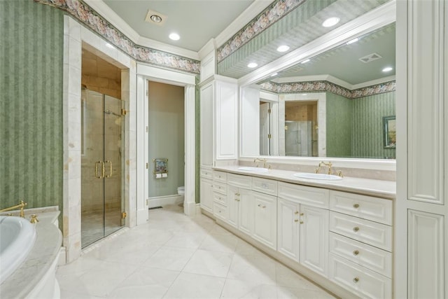 368 Millbrook Dr, Norman, OK 73072 - full bathroom featuring toilet, a shower stall, wallpapered walls, a bath, and double vanity