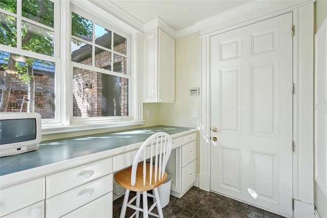 368 Millbrook Dr, Norman, OK 73072 - home office with built in desk, stone finish floors, and ornamental molding