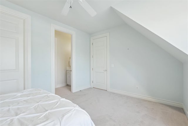 368 Millbrook Dr, Norman, OK 73072 - bedroom with lofted ceiling, light colored carpet, baseboards, connected bathroom, and ceiling fan